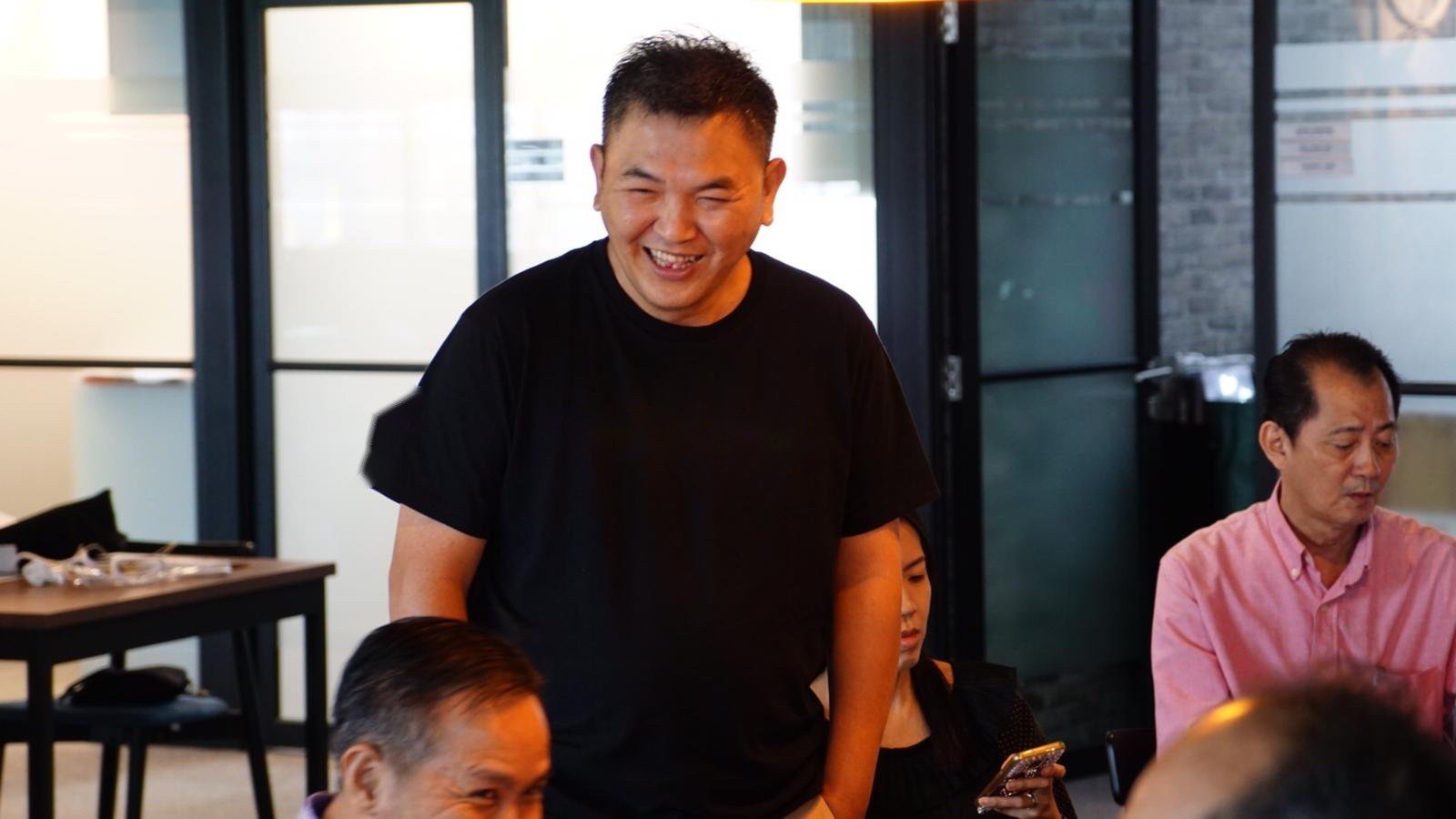 John Ong sharing with industry practitioners at a training session